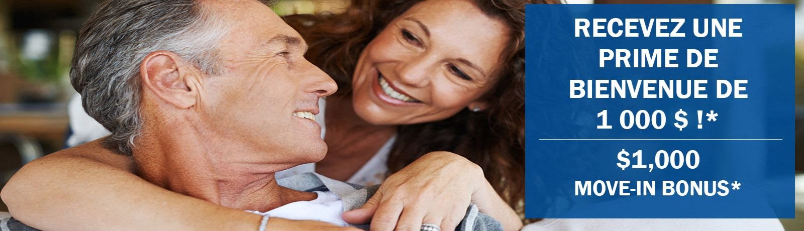 Happy senior couple smiling' receive $1,000 Move-In Bonus' L'Esterel Pointe Claire QC
